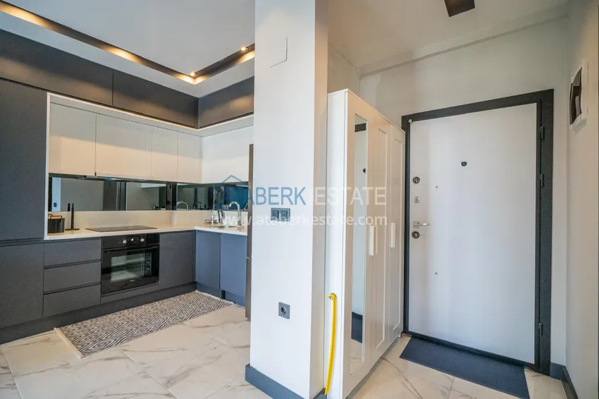 Приобрести Двухкомнатная квартира с новой мебелью в центр Махмутлара, район субботнего рынка 2 