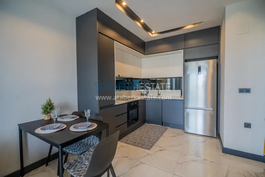 Приобрести Двухкомнатная квартира с новой мебелью в центр Махмутлара, район субботнего рынка 3 