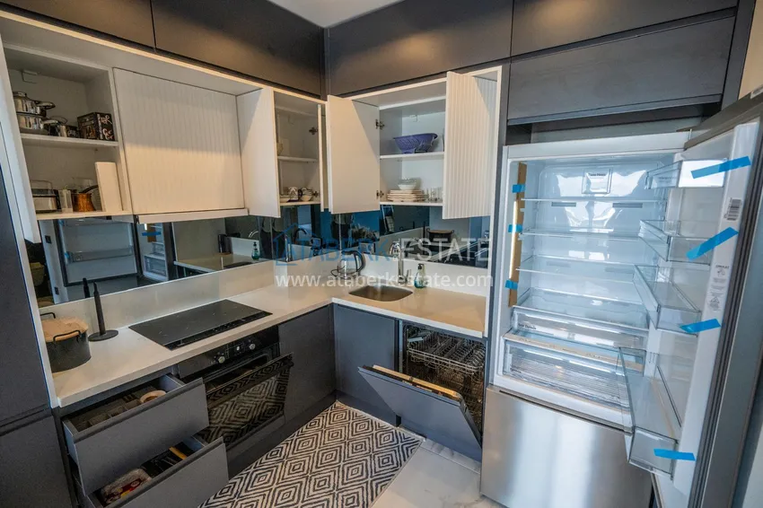 Приобрести Двухкомнатная квартира с новой мебелью в центр Махмутлара, район субботнего рынка 6 