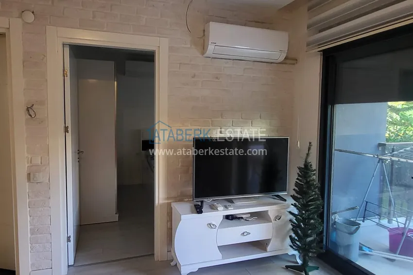 Приобрести Квартира 1+1 под ВНЖ в центре Алании – с мебелью и  частным садом в 150 метрах от моря  12 