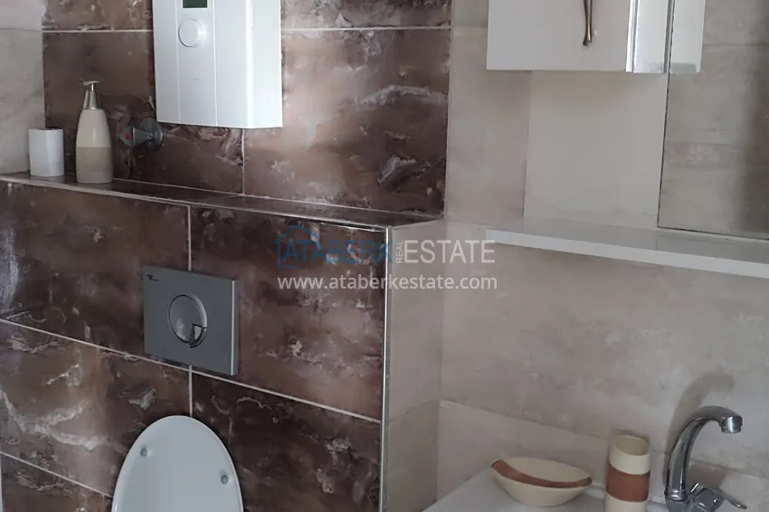 Приобрести Квартира 1+1 в Тосмуре с мебелью в шаге от моря – подходит для оформления ВНЖ 9 