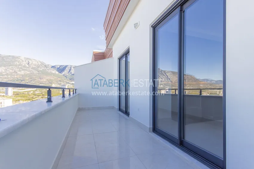 Приобрести Элитный двухэтажный пентхаус 4+1 с видом на море и крепость - центр Махмутлара 12 