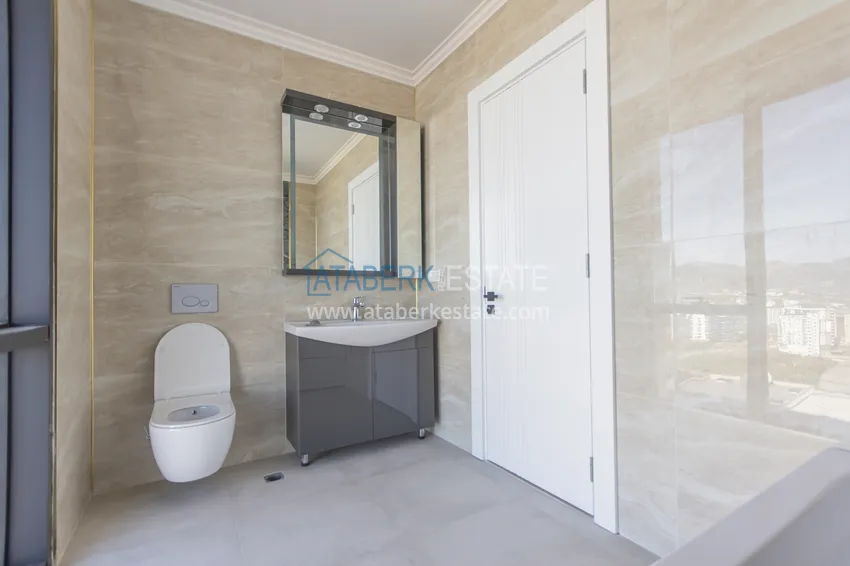 Приобрести Элитный двухэтажный пентхаус 4+1 с видом на море и крепость - центр Махмутлара 29 