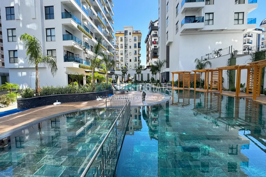 Квартира 1+1 с видом на горы в Махмутларе - комплекс курортного формата 11