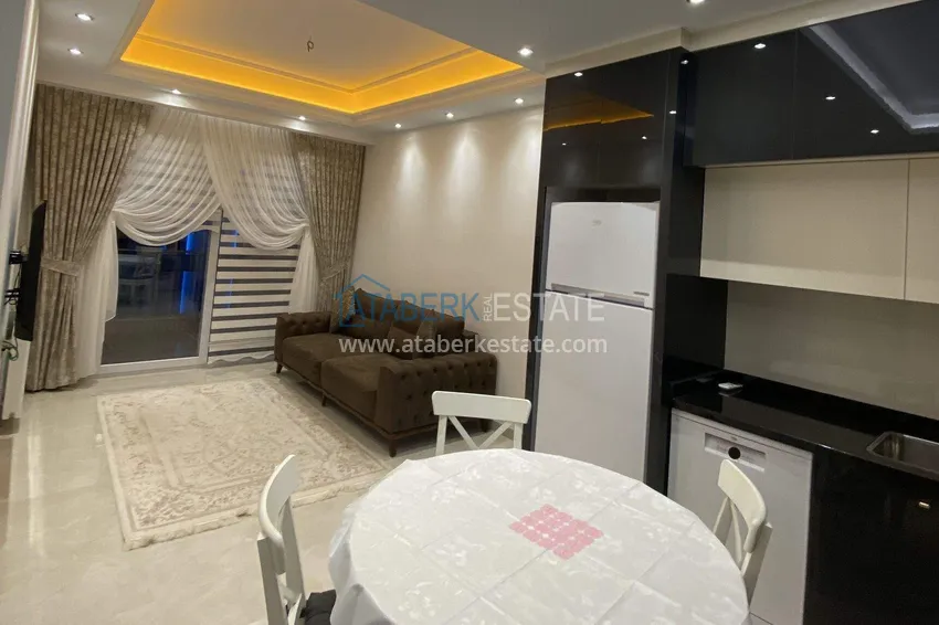 Приобрести Квартира 1+1 70 м² в центре Махмутлара – с мебелью, балкон остеклен, рассрочка до 1 года 2 