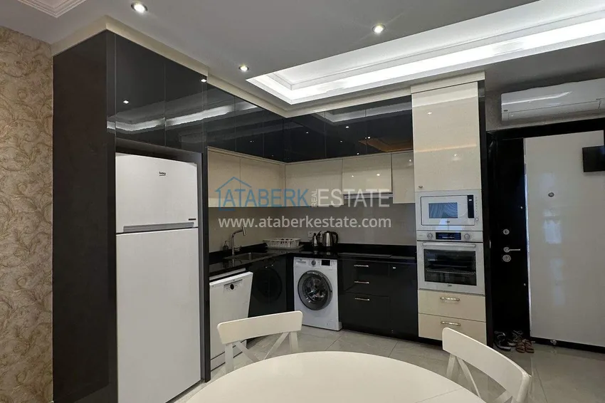 Приобрести Квартира 1+1 70 м² в центре Махмутлара – с мебелью, балкон остеклен, рассрочка до 1 года 5 