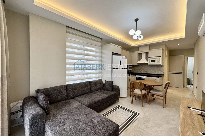 Приобрести Квартира 1+1 с новой мебелью в Махмутларе - 400 метров до моря, улица Ататюрка 2 