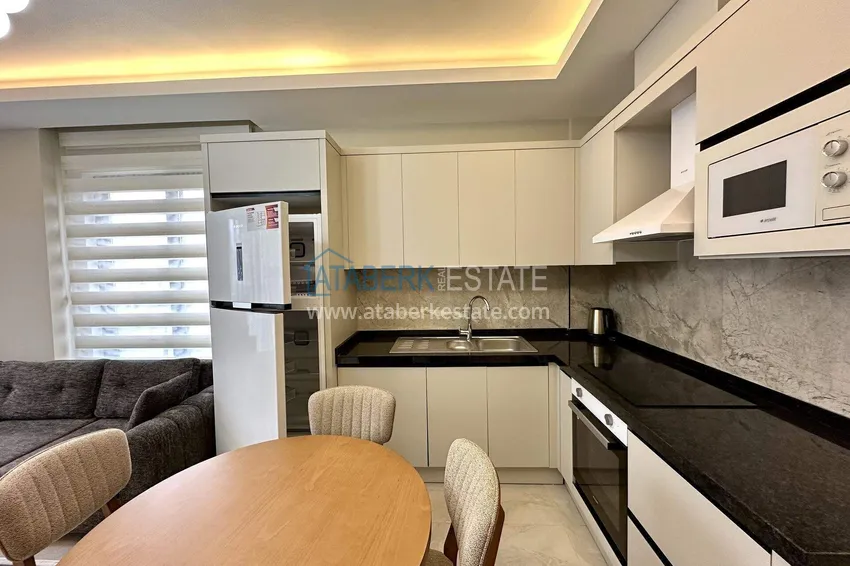 Приобрести Квартира 1+1 с новой мебелью в Махмутларе - 400 метров до моря, улица Ататюрка 6 