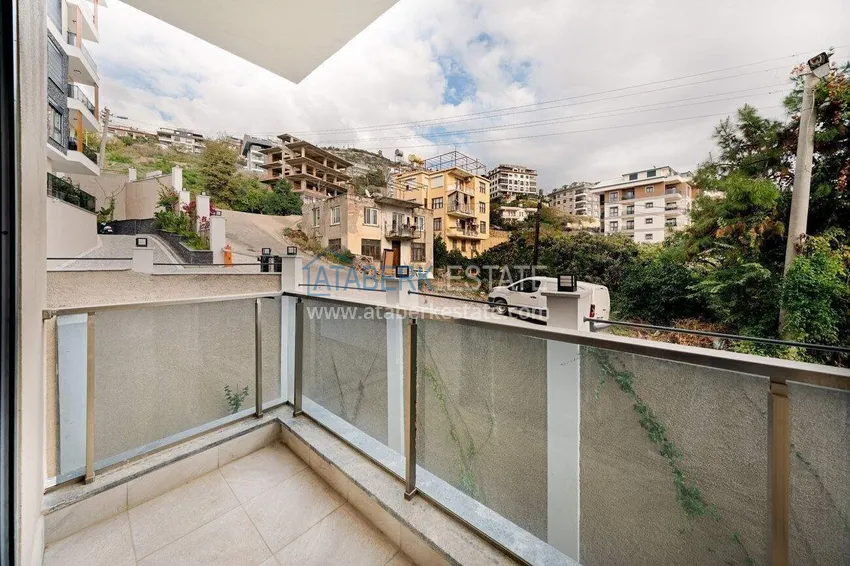 Приобрести Трехкомнатная квартира в центре Алании - новая недвижимость в резиденции комфорт-класса 10 