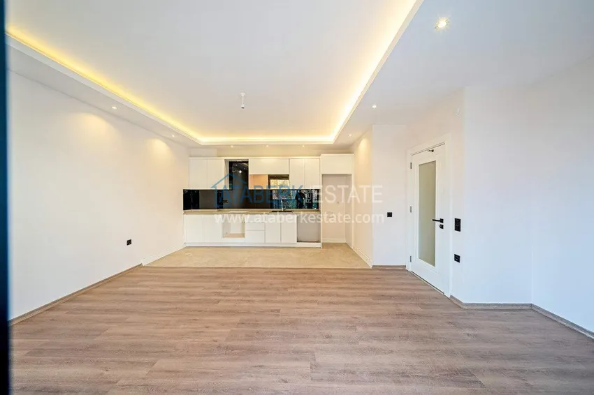 Приобрести Трехкомнатная квартира в центре Алании - новая недвижимость в резиденции комфорт-класса 1 