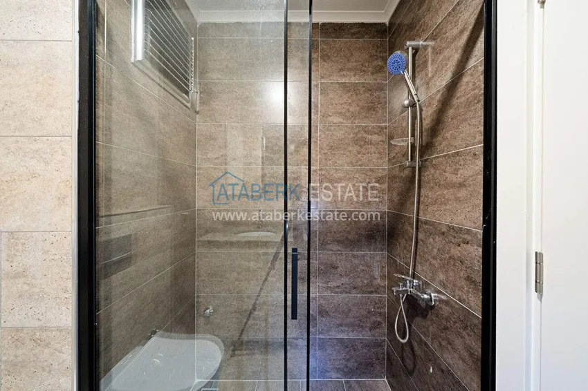 Приобрести Трехкомнатная квартира в центре Алании - новая недвижимость в резиденции комфорт-класса 7 