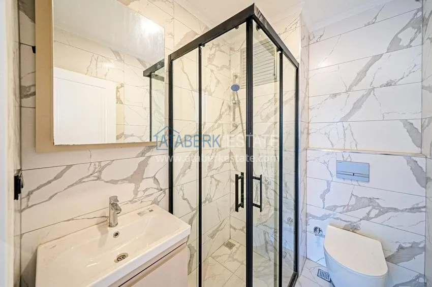 Приобрести Трехкомнатная квартира в центре Алании - новая недвижимость в резиденции комфорт-класса 8 