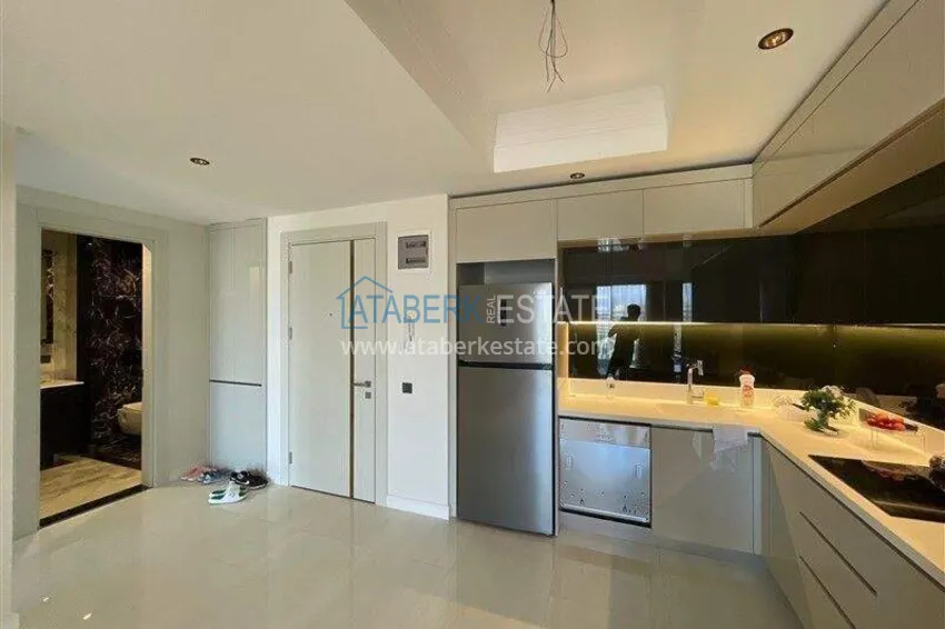 Приобрести Недвижимость в Алании - квартира 1+1 85 м2 с мебелью в премиальном resort-комплексе, район Тюрклер 1 