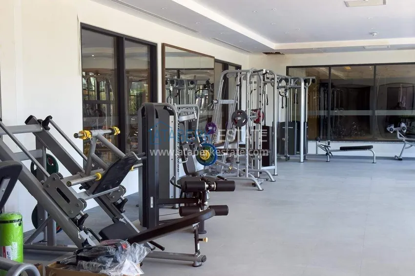 Недвижимость в Алании - квартира 1+1 85 м2 с мебелью в премиальном resort-комплексе, район Тюрклер 61 