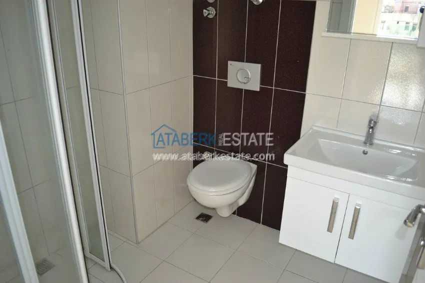 Приобрести Трехкомнатные апартаменты площадью 120 м2 в районе Махмутлар, Алания 18 