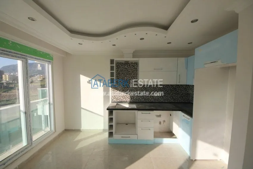 Приобрести Апартаменты 1+1 в  современном комплексе от надежного застройщика в районе Махмутлар 32 