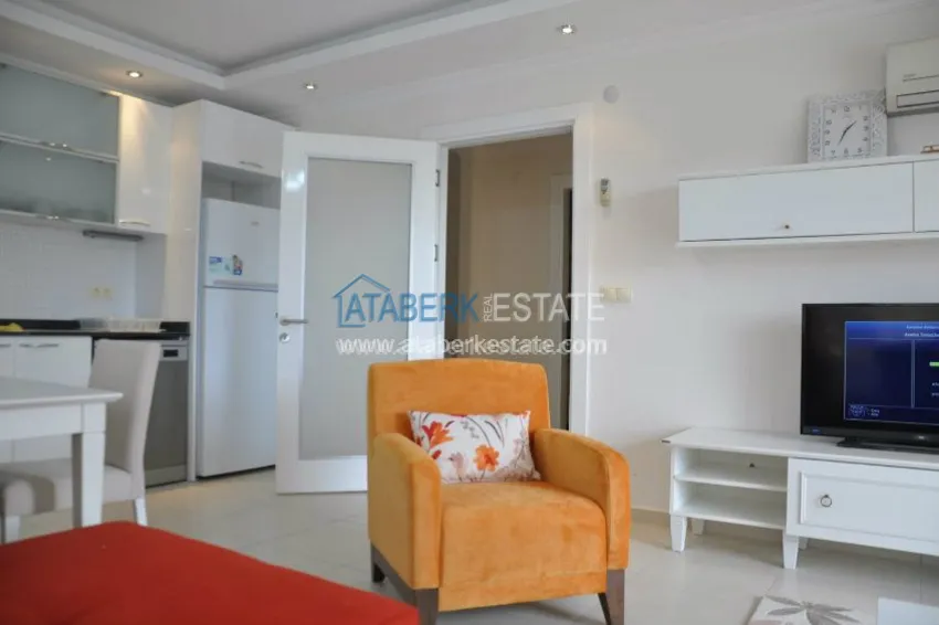 Приобрести Апартаменты 1+1 с собственным пляжем в районе Авсаллар 12 