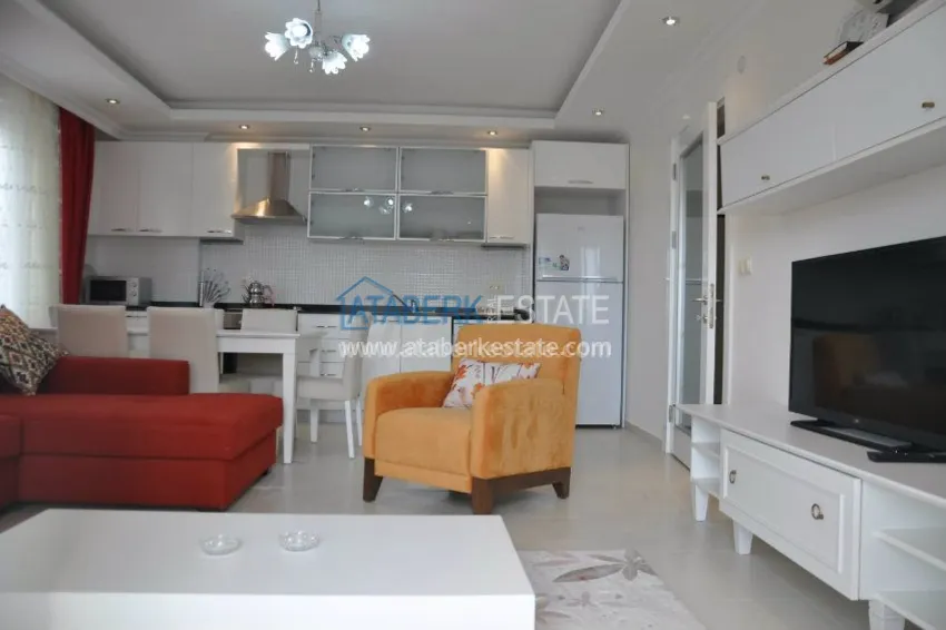 Приобрести Апартаменты 1+1 с собственным пляжем в районе Авсаллар 13 