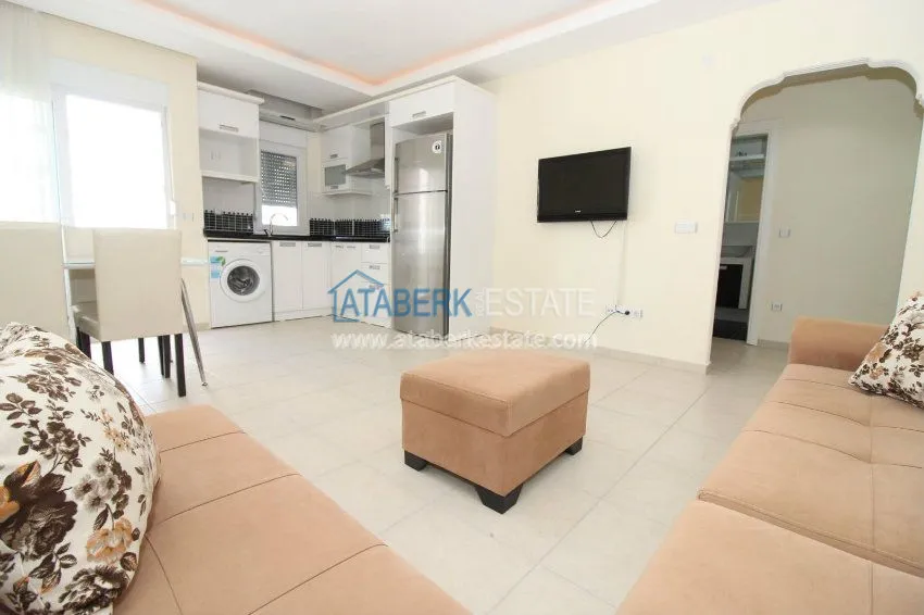 Приобрести Меблированные апартаменты 1+1 в 200 метрах от пляжей. 8 