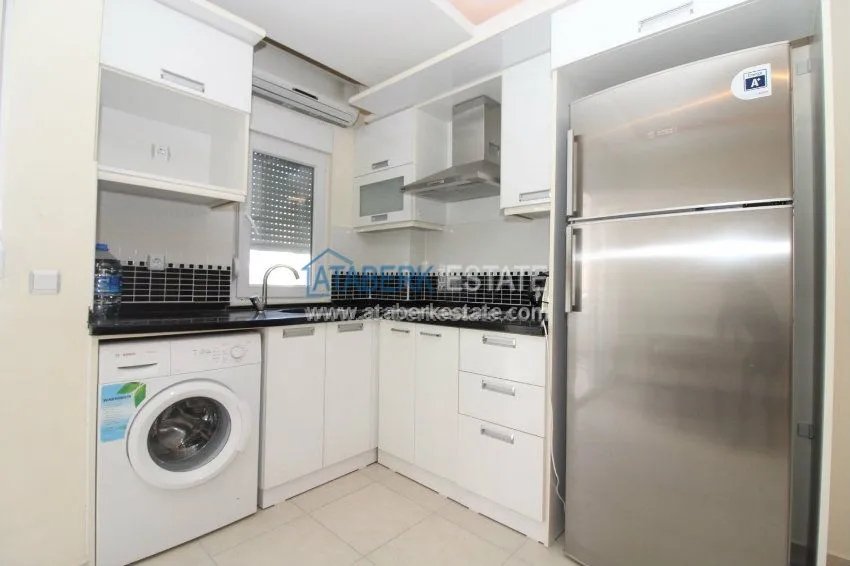 Приобрести Меблированные апартаменты 1+1 в 200 метрах от пляжей. 12 