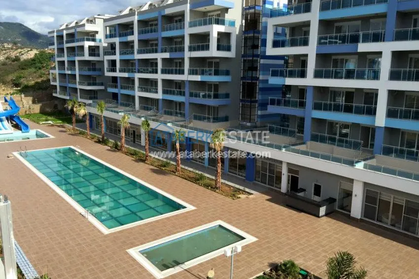 Квартирный комплекс с инфраструктурой отеля 5 звезд недалеко от моря в Алании 1 