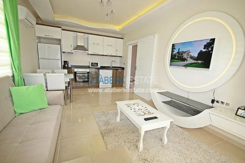 Квартира 1+1 в современном комплексе в Махмутларе 11 