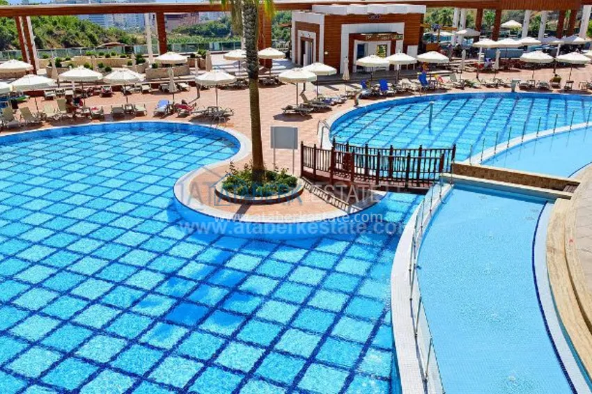 Апартаменты 1+1 в роскошном комплексе в районе Махмутлар 11 