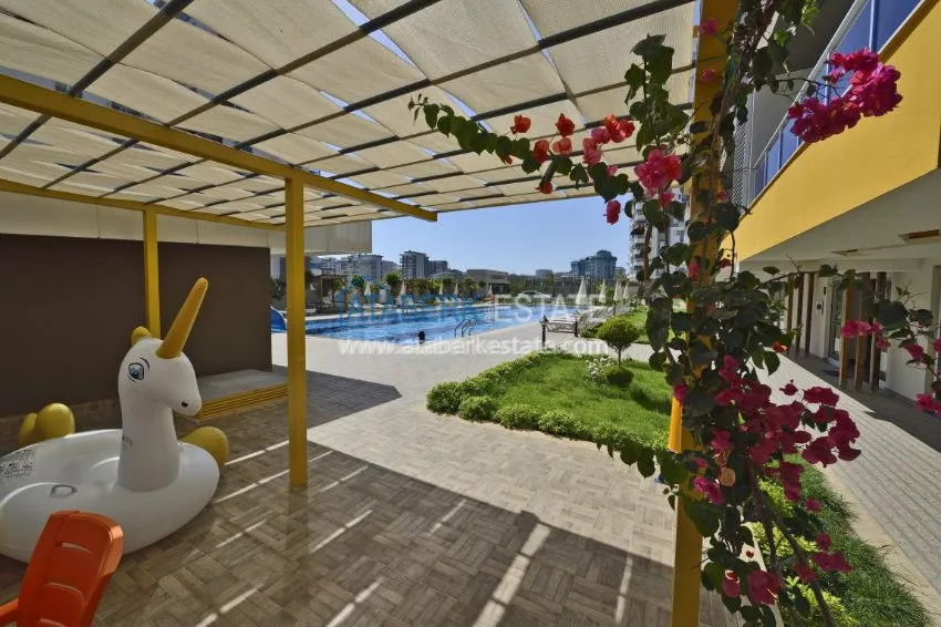 Трехкомнатная квартира в современном комплексе Махмутлара 26 